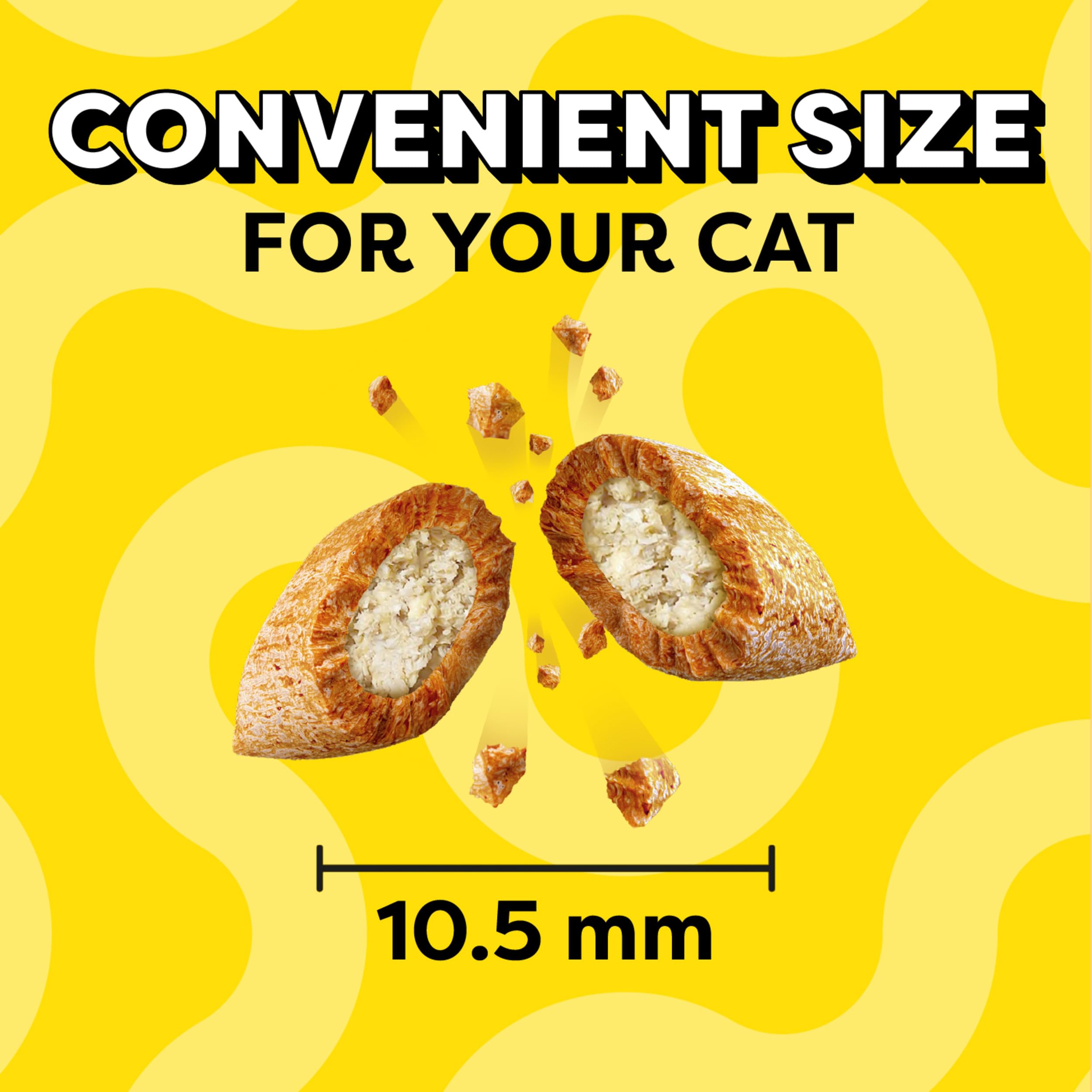Calm indoor cat savoring Temptations treats.