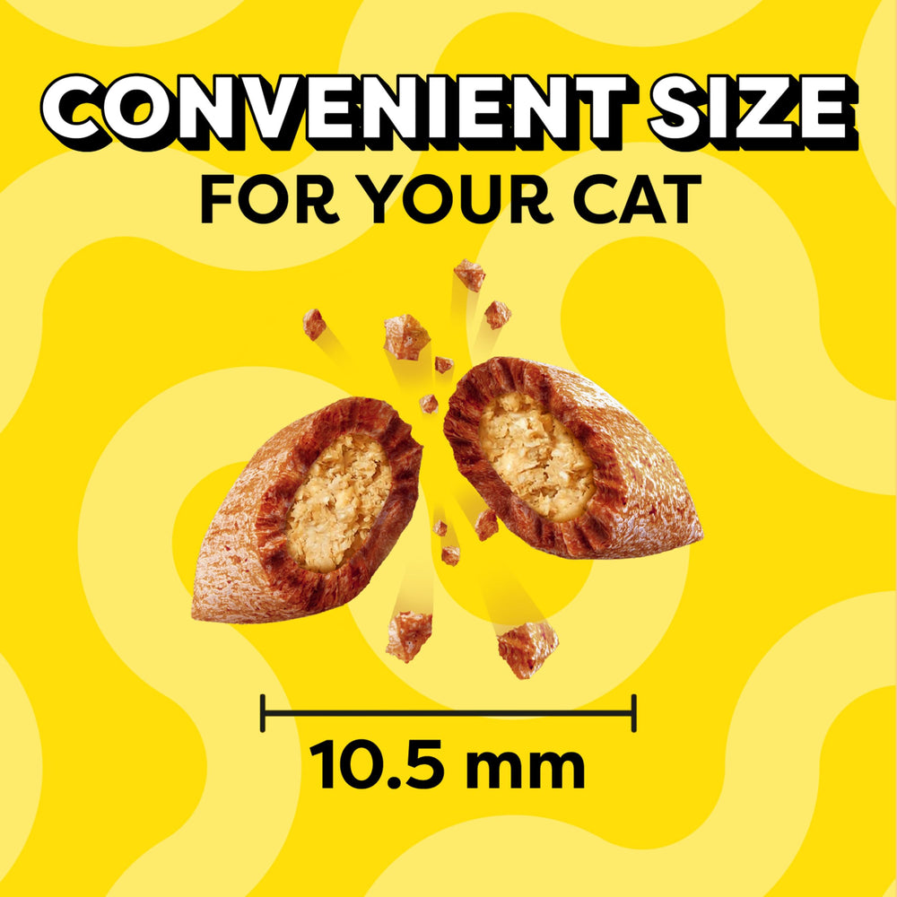 Cat eagerly associates treat time with Temptations and positive moments.