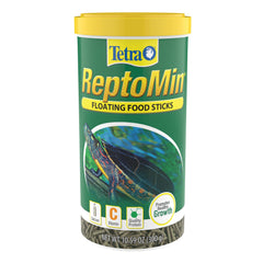 Tetra ReptoMin floating food sticks being poured from the bottle for convenient feeding.