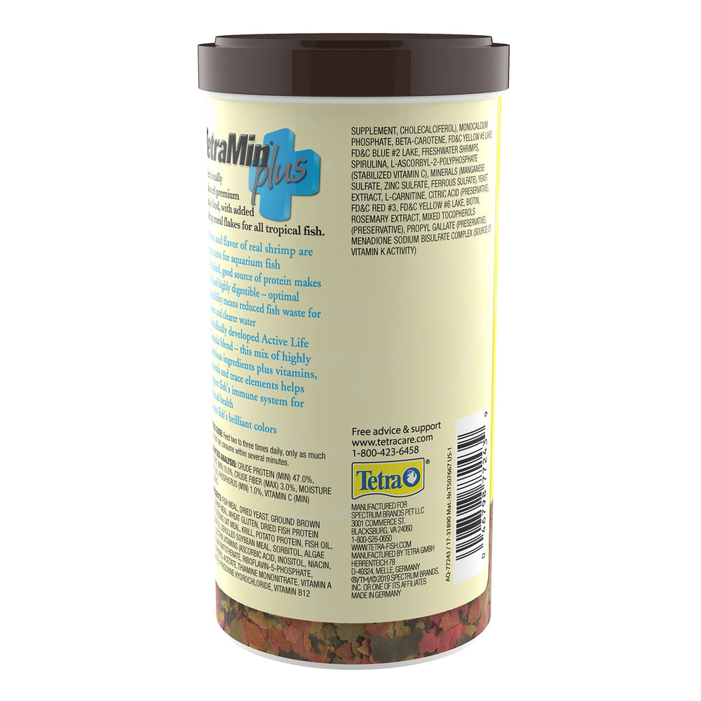TetraMin Plus Tropical Flakes feeding action with healthy, active tropical fish.