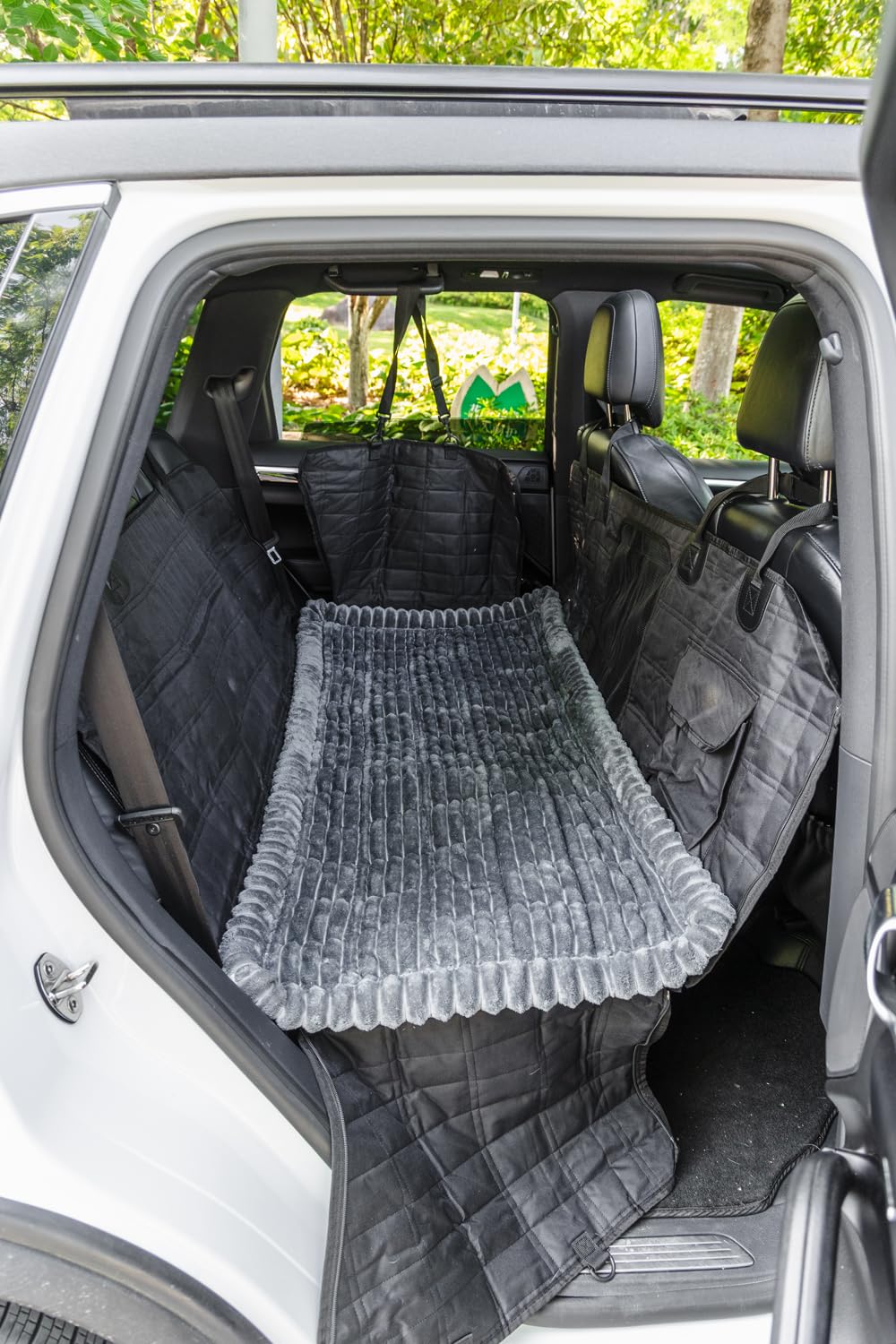 TGODGPY fuzzy backseat pet mat adds cozy padding for small to medium dogs.