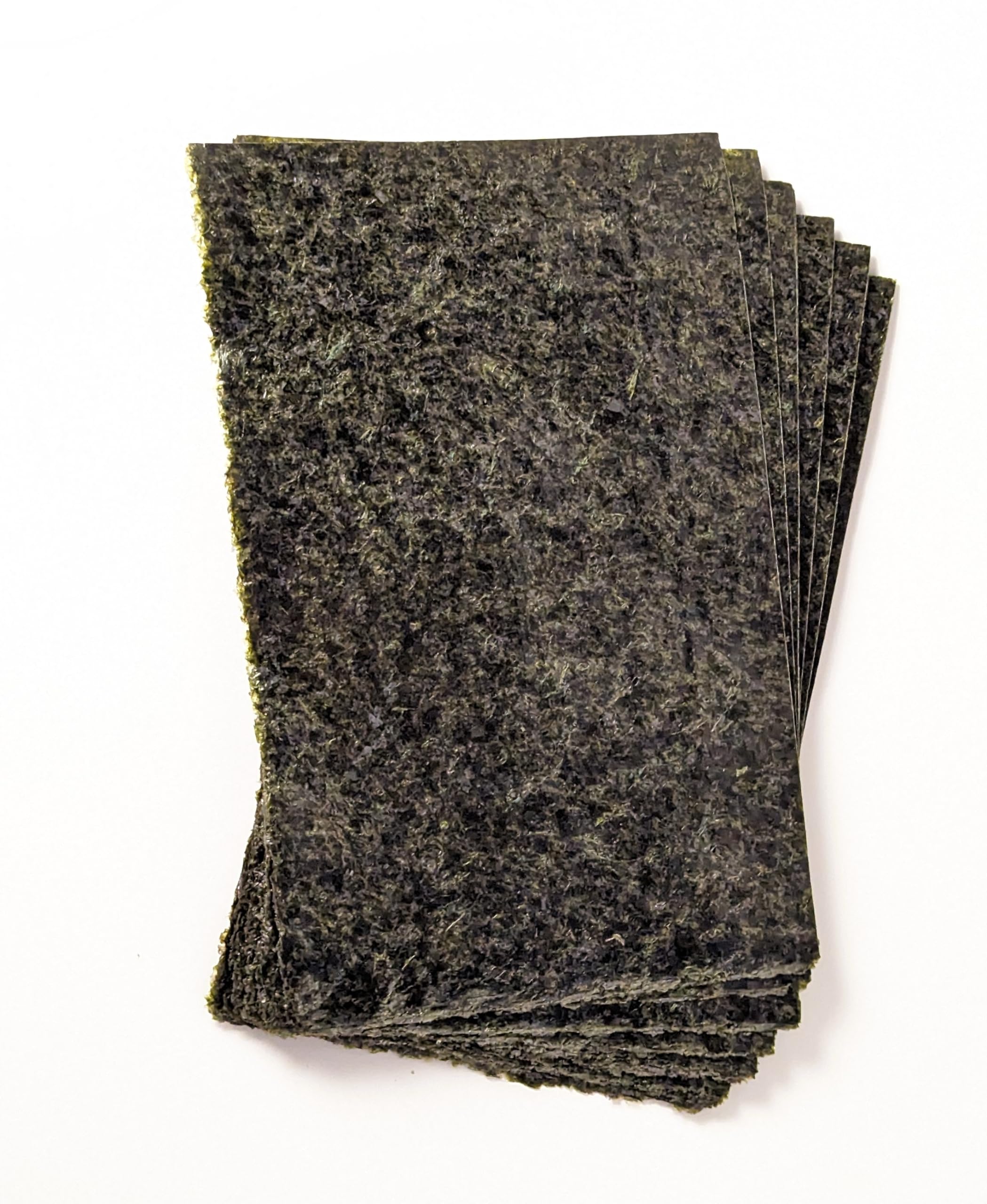 A veggie clip feeds The Coral Ranch nori to active reef-tank fish.