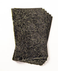 A veggie clip feeds The Coral Ranch nori to active reef-tank fish.