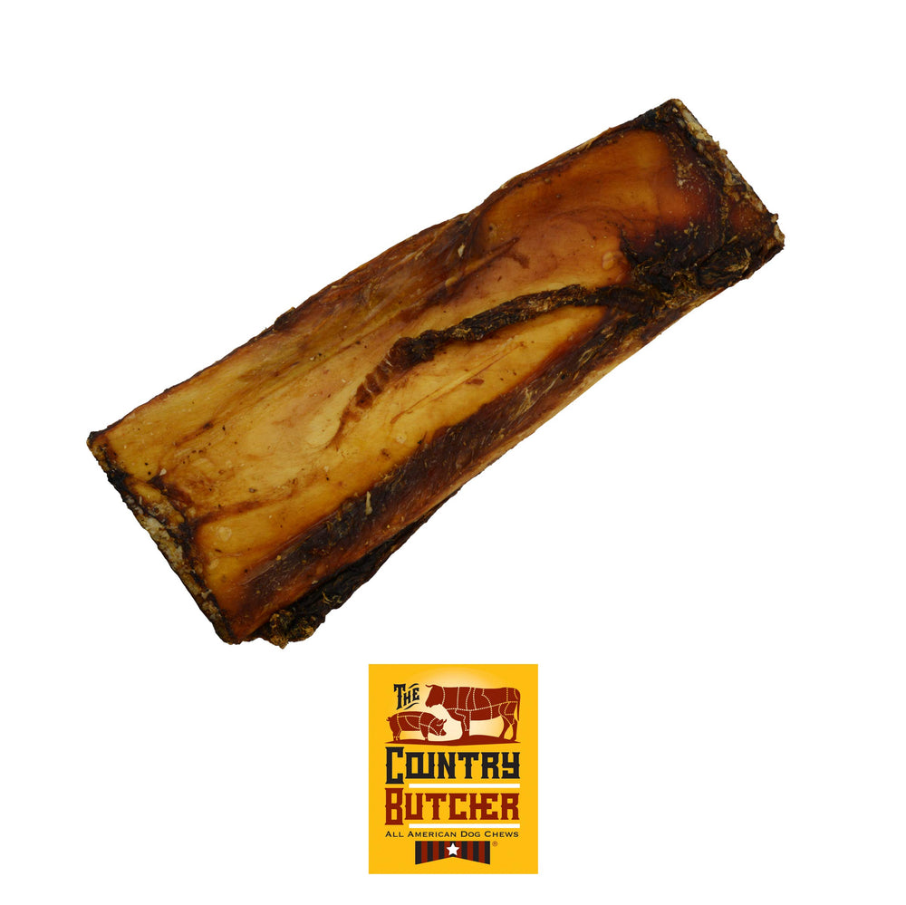 The Country Butcher Rib Bones Medium close-up with meaty tidbits for flavorful chewing.