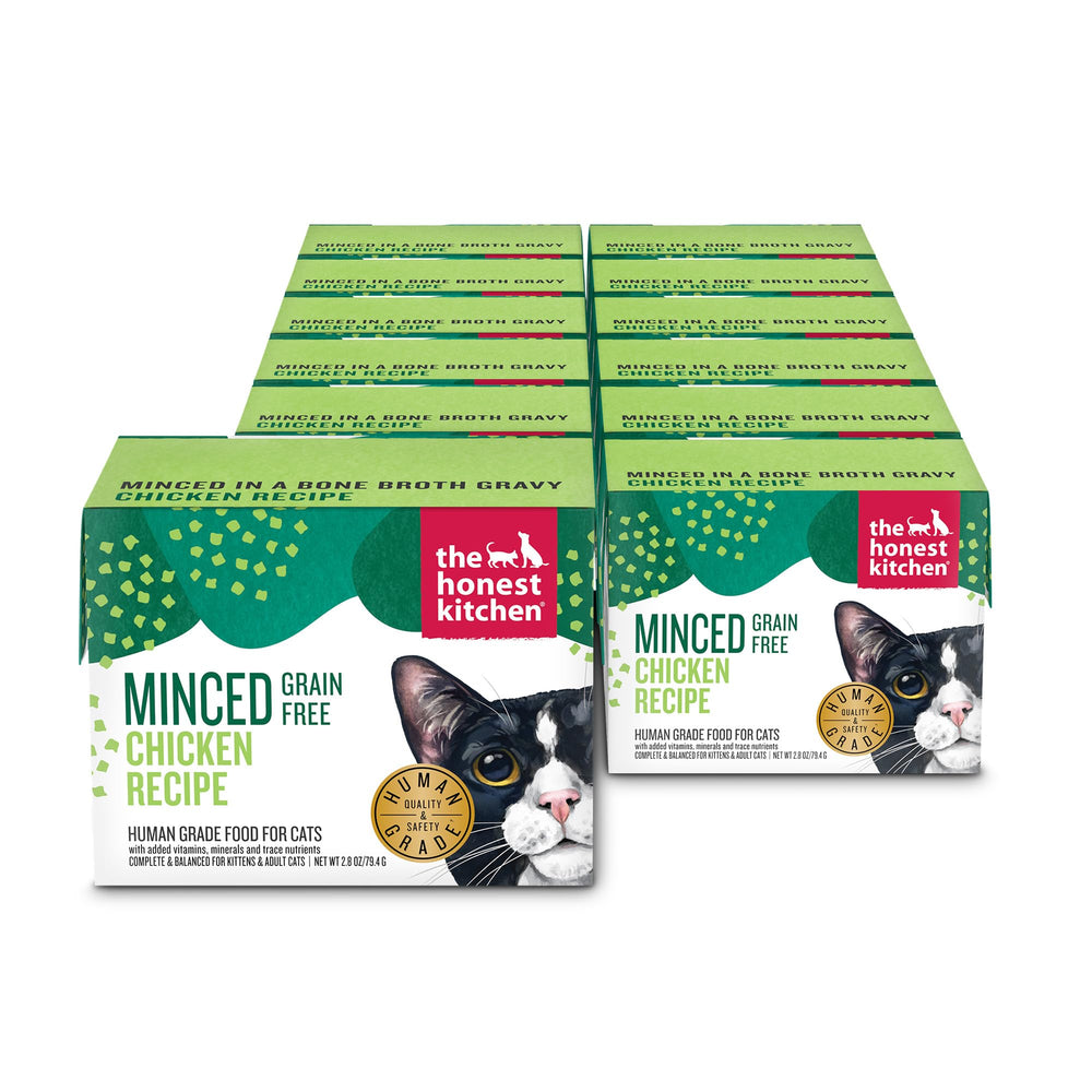 The Honest Kitchen minced chicken in bone broth gravy cat food in a serving bowl, grain-free and complete