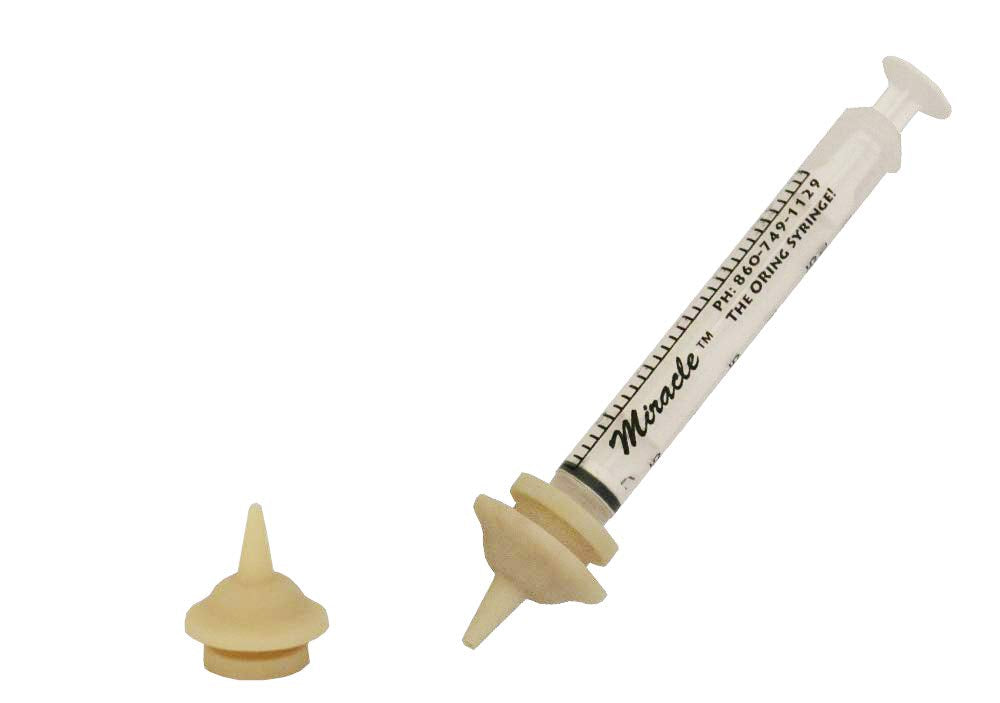 The Miracle Nipple Mini Pkg with two nipples and a 3ml syringe for infant feeding.