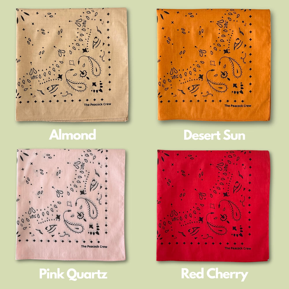The Peacock Crew Sunset bandana folded-style demonstrates a compact, chic accessory.