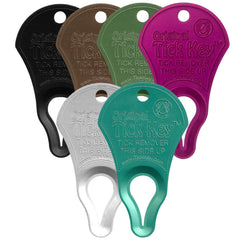 The Tick Key portable tick removal tool in hand for quick outdoor relief.