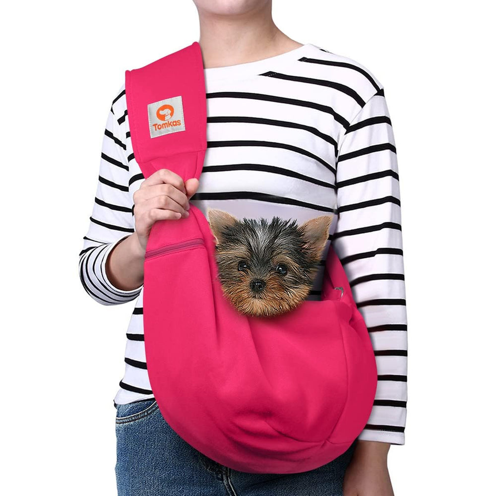 TOMKAS rose red dog sling with front pocket for essentials and secure transport.