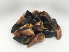 Top Dog Chews cow hooves dog chew use illustrates a dental-friendly option for pets.