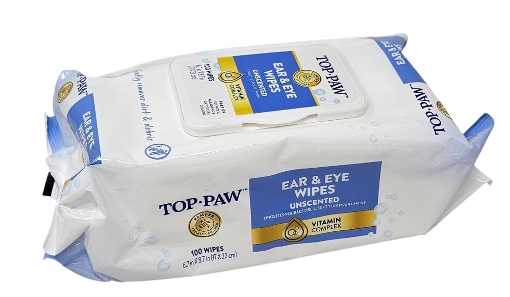 Using TOP PAW wipes around dog's ears to remove dirt and debris.