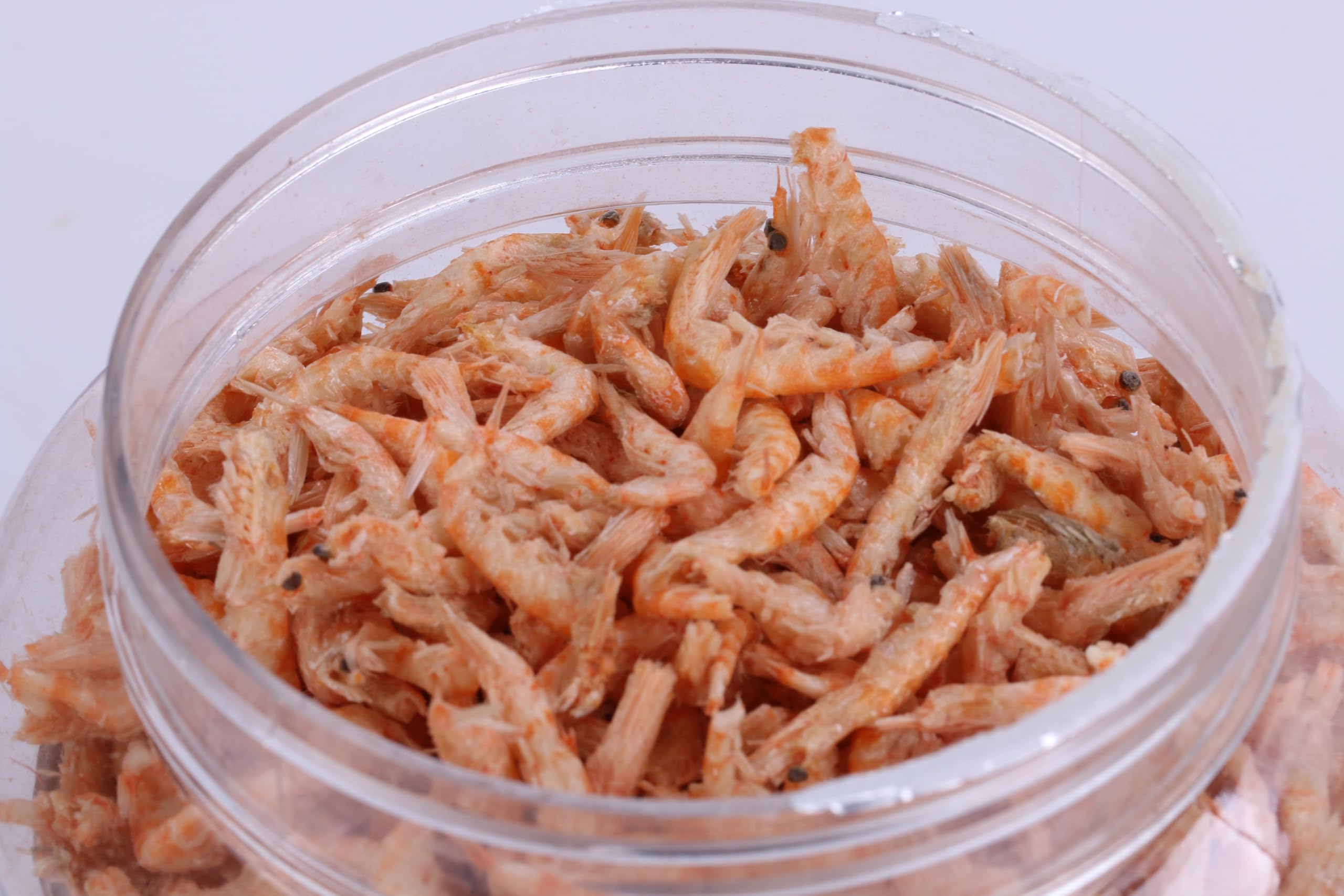 Toyuto krill-shrimp mix in diverse aquarium with koi.