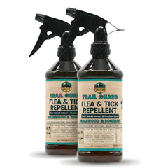 Trail Guard natural spray bottle with cedarwood and rosemary essential oils for pest protection.