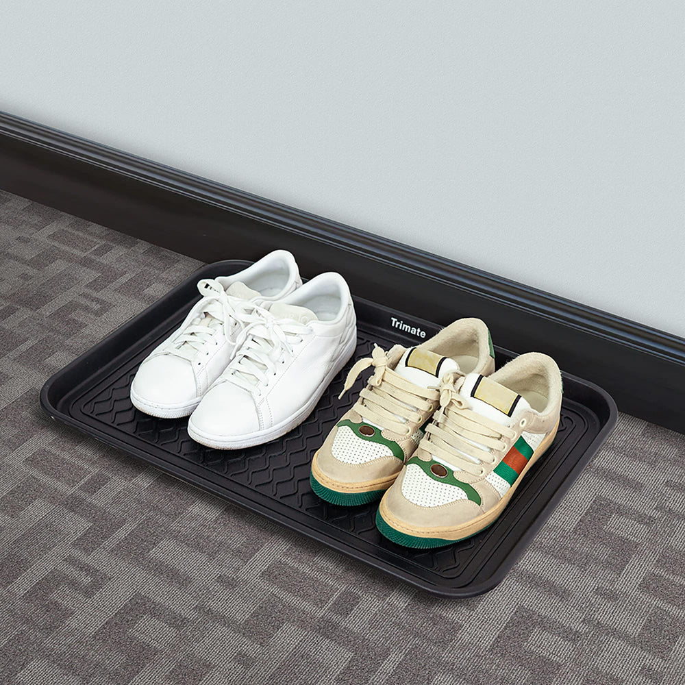 Trimate boot tray stacked with shoes demonstrates space-saving and quick drying benefits.
