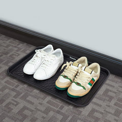 Trimate boot tray stacked with shoes demonstrates space-saving and quick drying benefits.