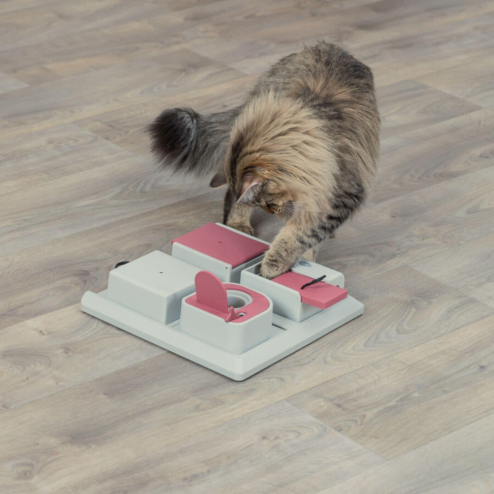 TRIXIE Poker Box sliding compartments encourage hunting-style play and treat rewards.