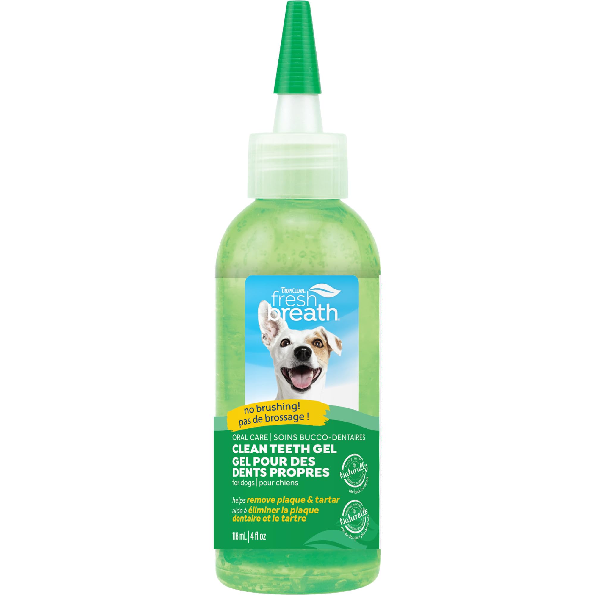 TropiClean Fresh Breath toothpaste applied to dog's teeth for fresher breath.