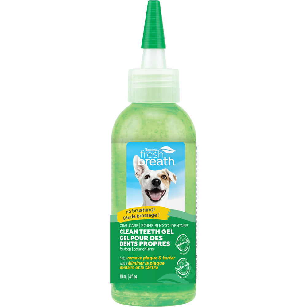 TropiClean Fresh Breath toothpaste applied to dog's teeth for fresher breath.