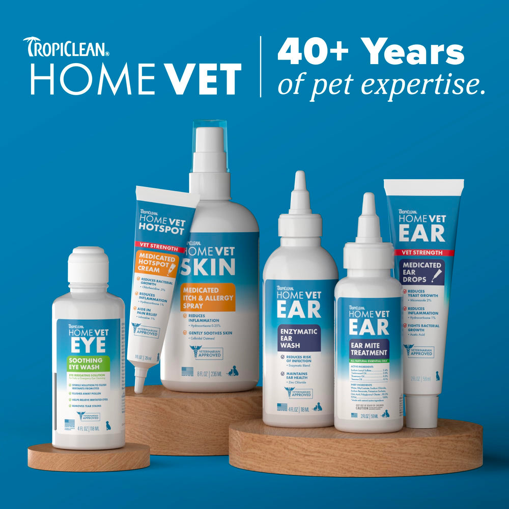 Gently spreading TropiClean HomeVet cream across irritated paw pads.