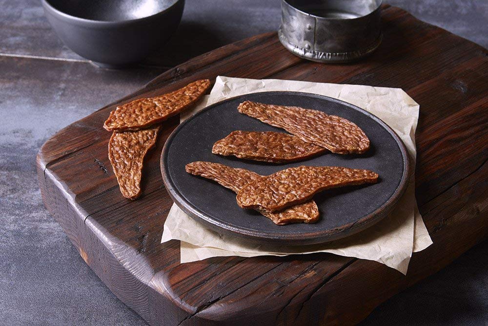 True Chews jerky close-up reveals tender, natural chicken pieces.
