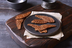 True Chews jerky close-up reveals tender, natural chicken pieces.