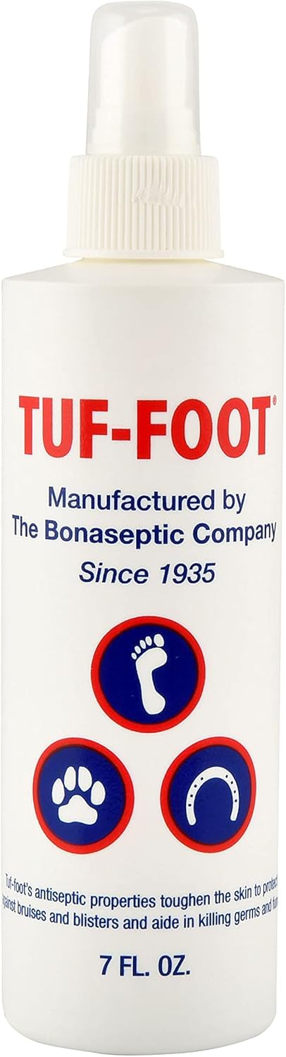 TUF-FOOT bottle shown ready to protect a dog's paw from hot pavement.