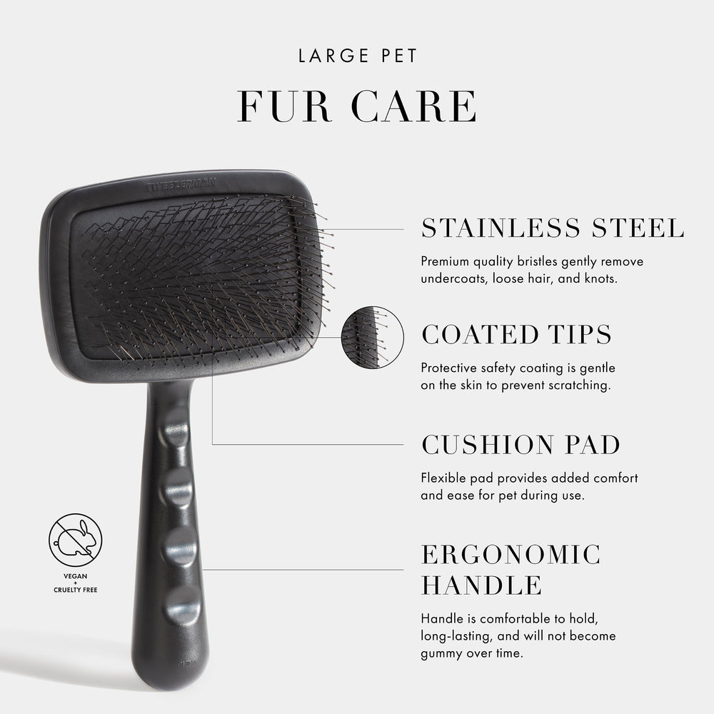 Tweezerman slicker brush with cushion pad adds comfort during grooming.