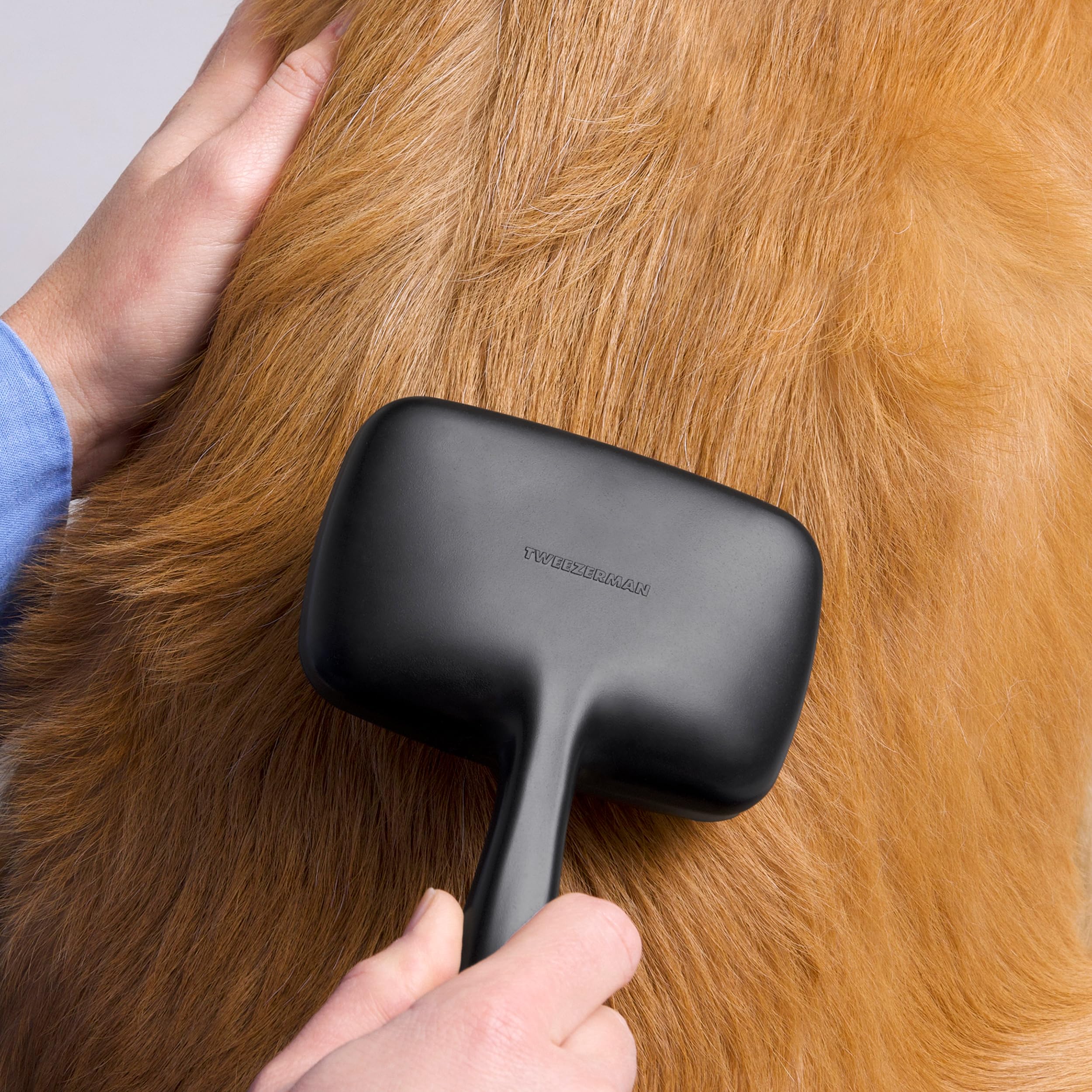 Tweezerman slicker brush ergonomic handle provides comfortable grooming for you and pet.