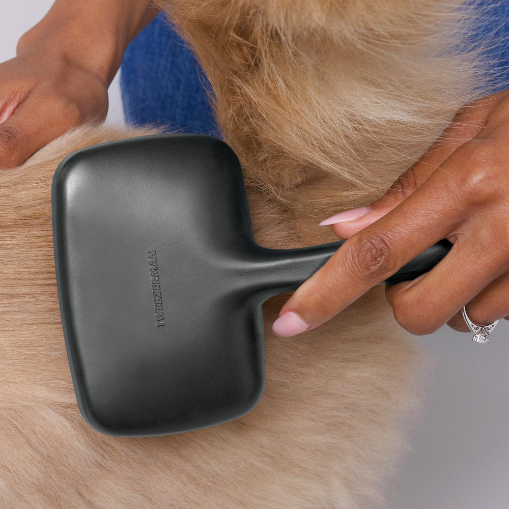Tweezerman slicker brush detangles knots and removes undercoat on dogs and cats.