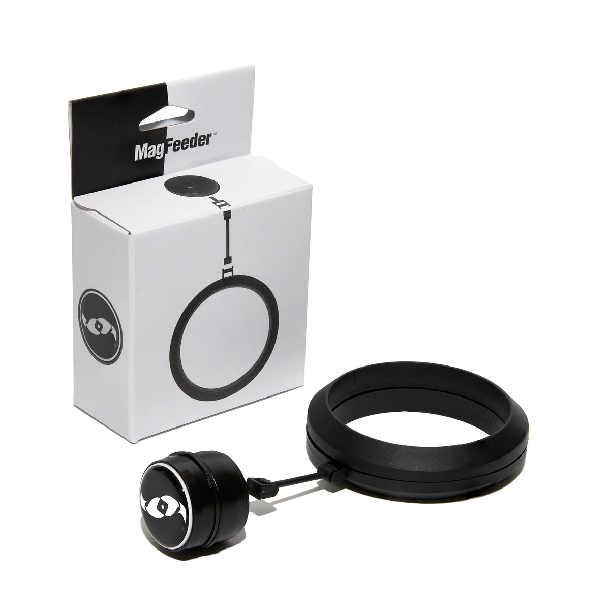 Two Little Fishies MagFeeder magnetic ring attached to aquarium glass for precise feeding.