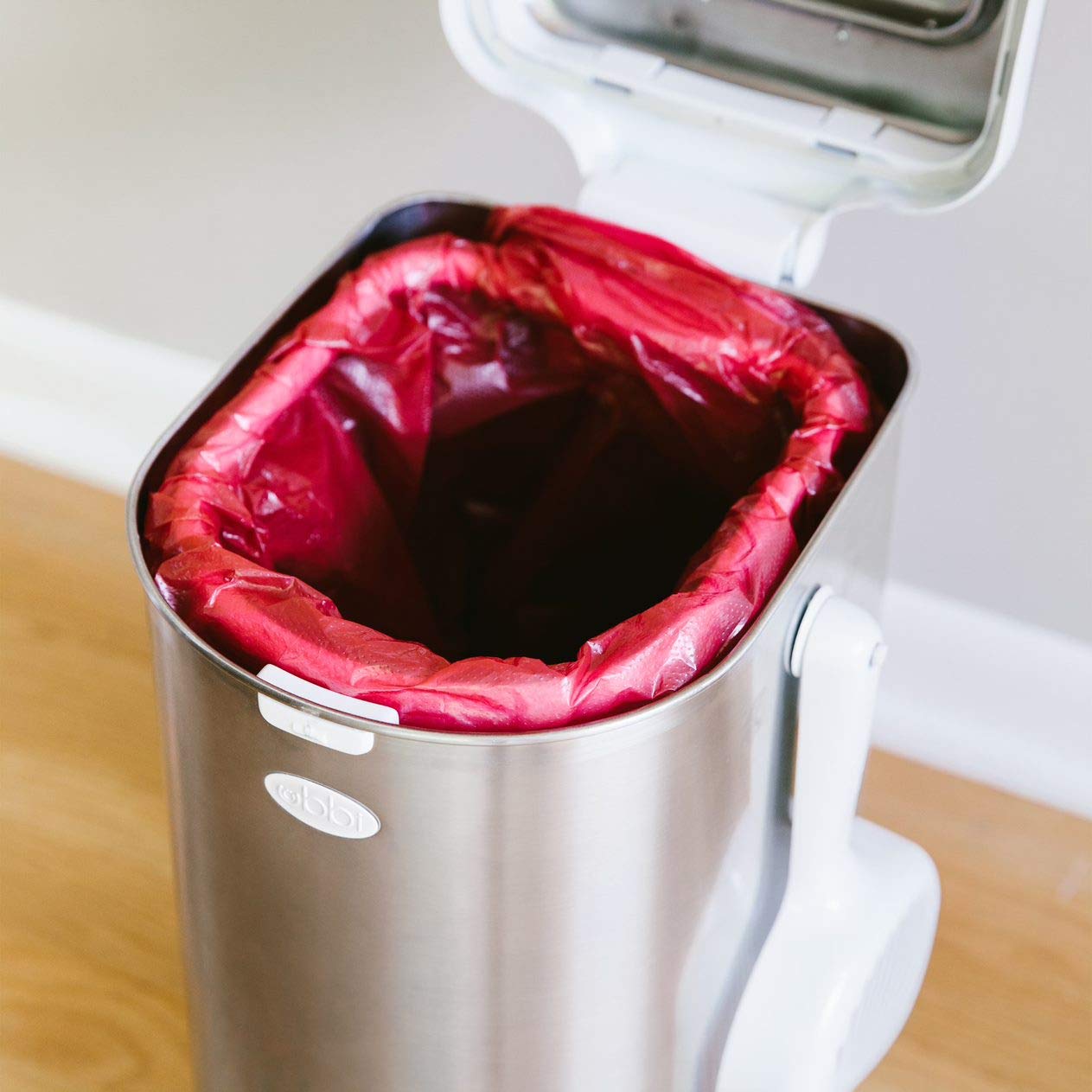 Ubbi bags fit the pet waste pail for easy maintenance
