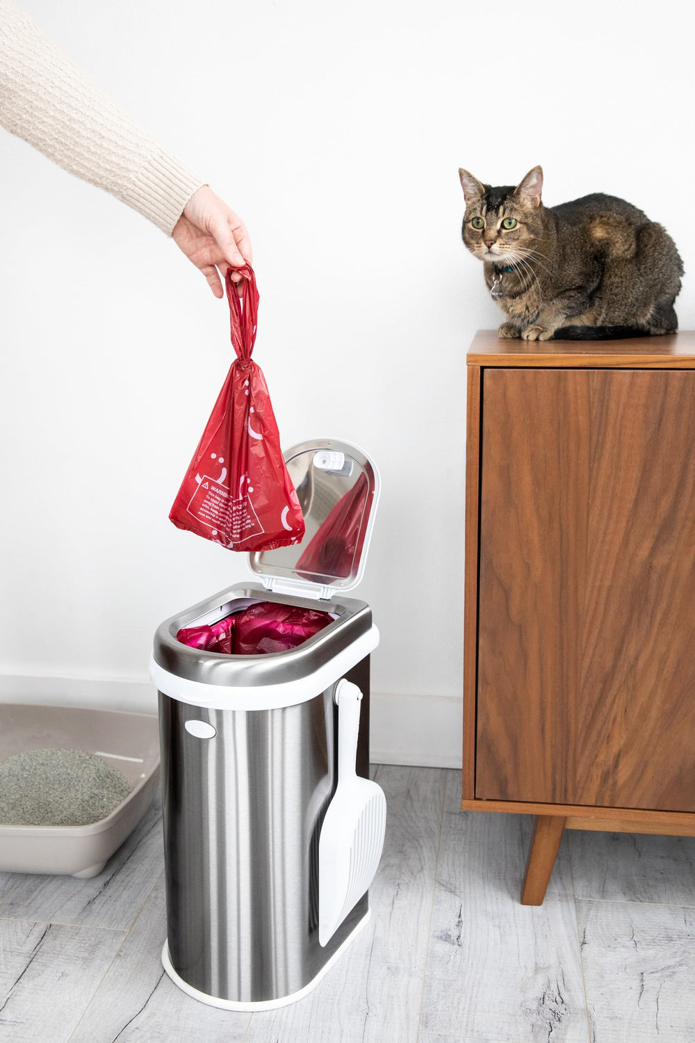 Ubbi Pet Waste Sacks protect hands during disposal.