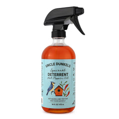 Uncle Dunkels spicy pepper deterrent bottle label shows all-natural solution for outdoor use.