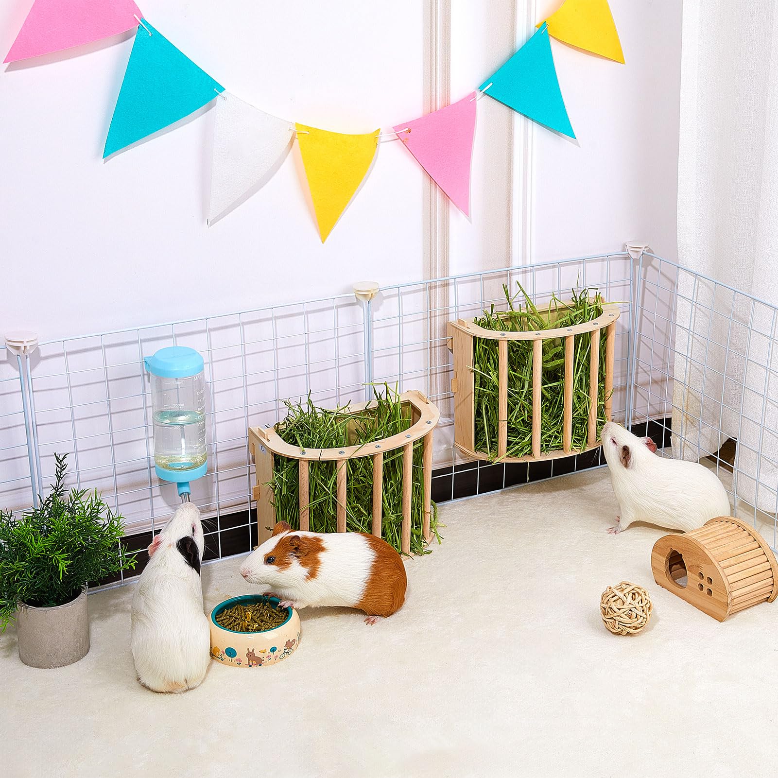 Unicorn Catcher guinea pig hay feeder in cage shows tidy, refill-friendly design.