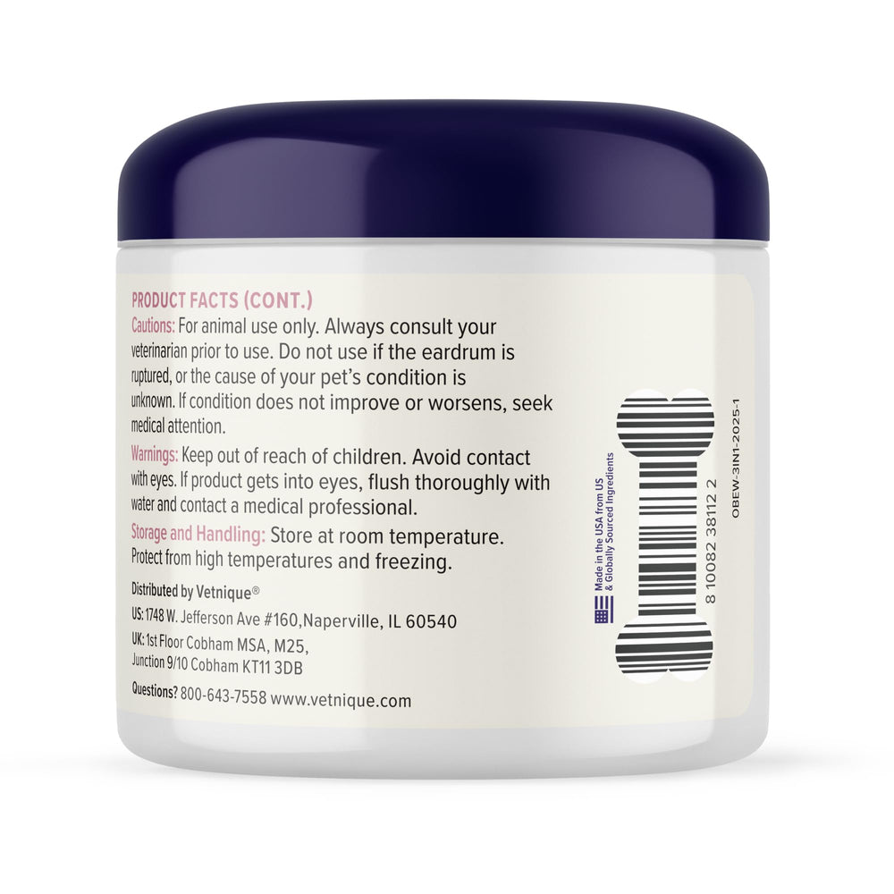 Dog ears being wiped during grooming with Vetnique Oticbliss.