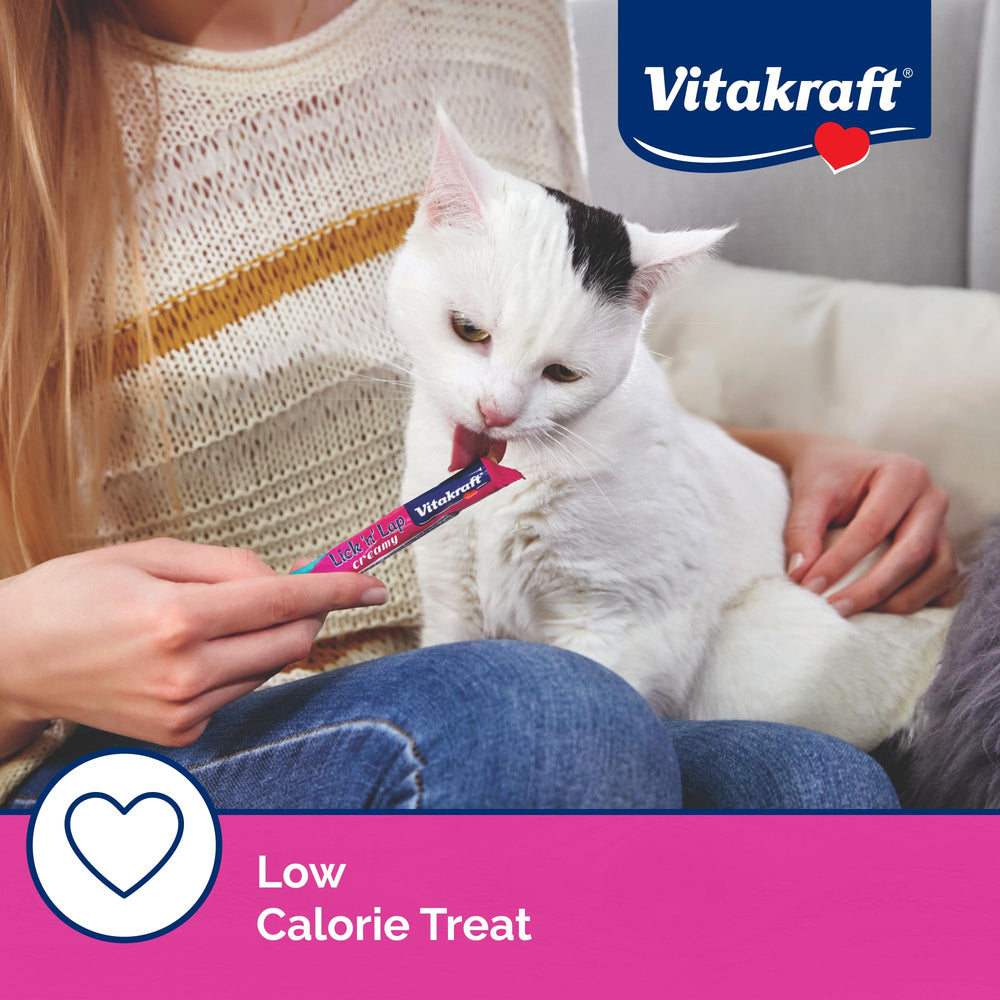 Cat enjoys Vitakraft Lick 'N' Lap served by hand