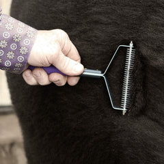 Wea ver Leather Livestock Shedding Comb showing no-slip grip for safe grooming.