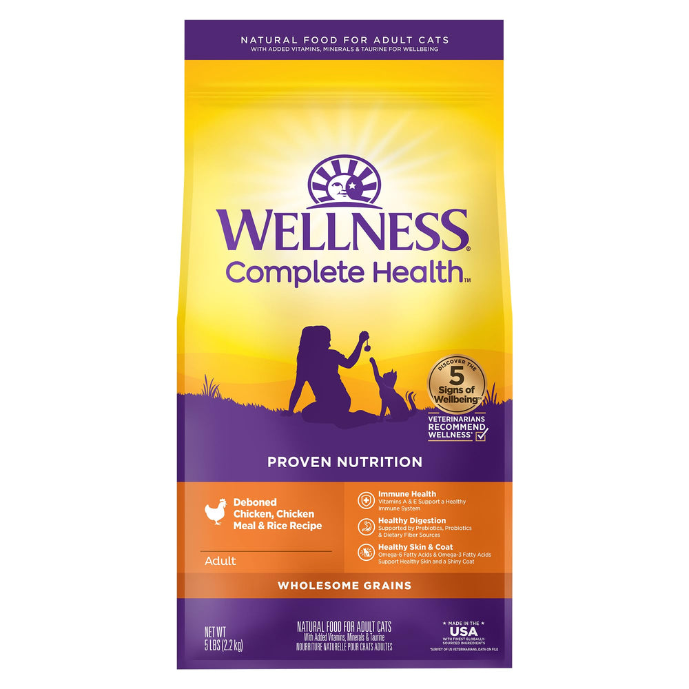 Wellness Complete Health chicken kibble close-up in a 5-pound bag, real chicken first ingredient