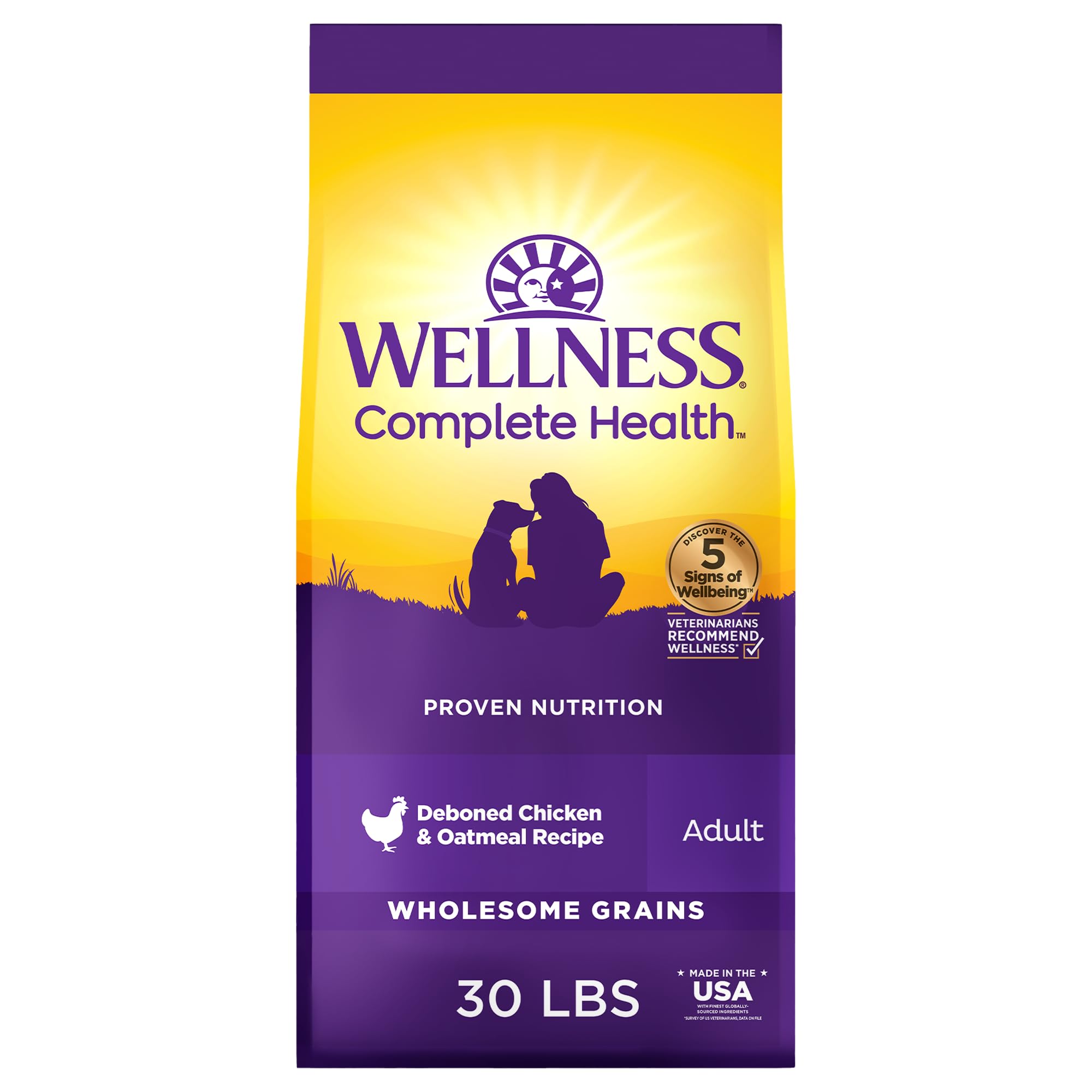 Wellness Complete Health kibble close-up with chicken and oats for balanced nutrition