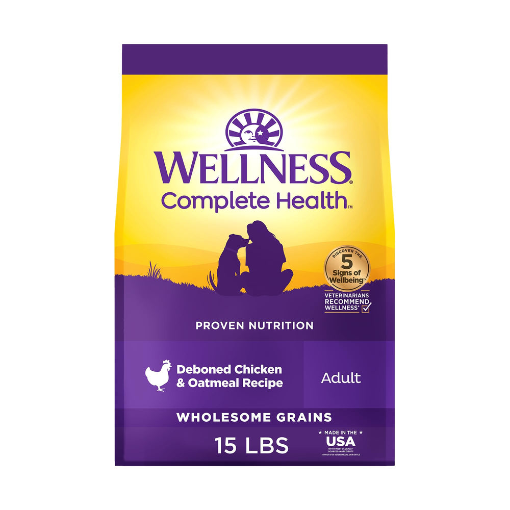 Wellness Complete Health dry dog food bag shows premium ingredients for daily nourishment.