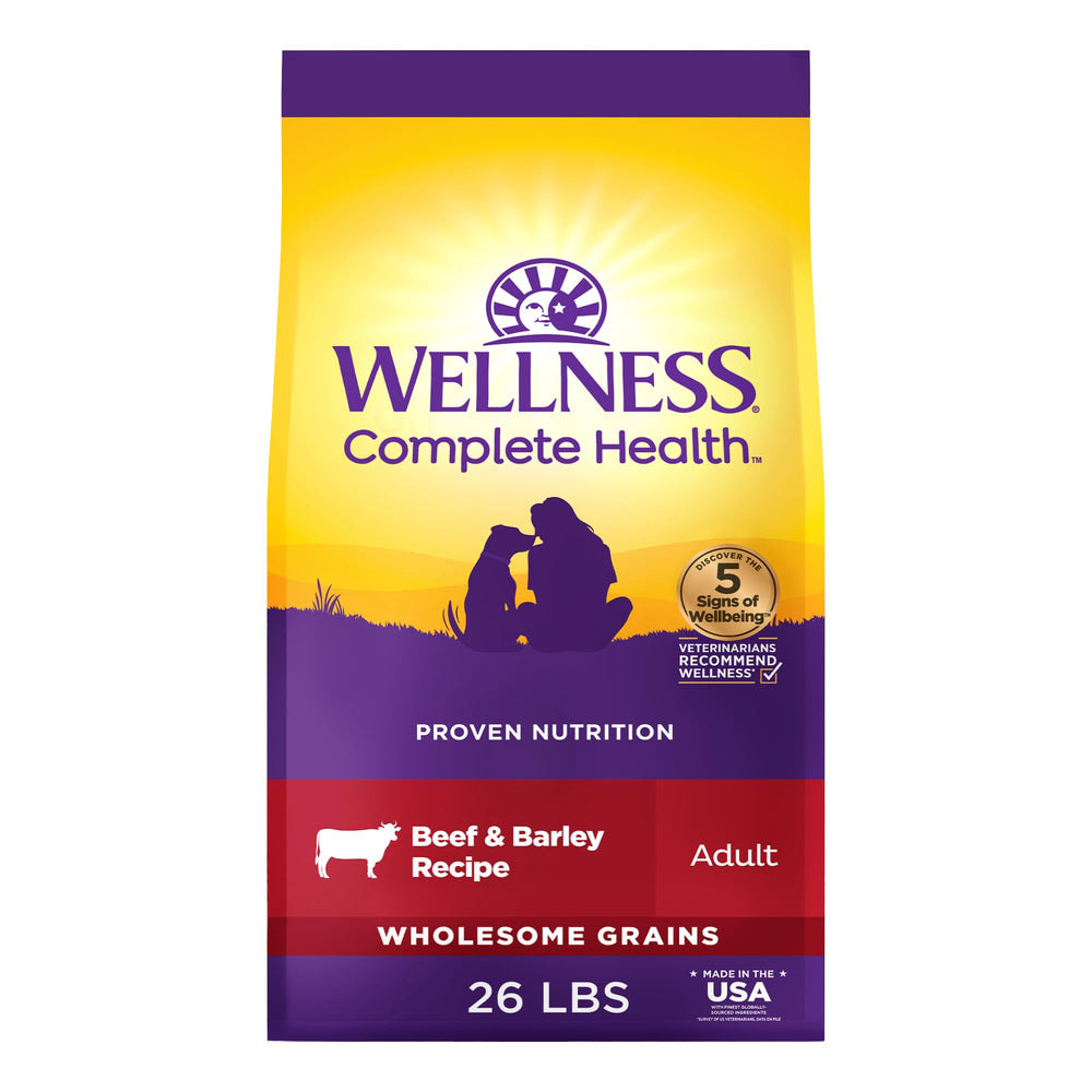 Wellness Complete Health dry dog food bag shows premium beef and barley nutrition for daily meals.