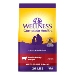Wellness Complete Health dry dog food bag shows premium beef and barley nutrition for daily meals.