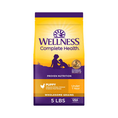 Wellness Complete Health puppy bag front showing real chicken and salmon formula.