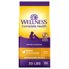Wellness Complete Health puppy packaging showing trusted, protein-rich formula for growing dogs