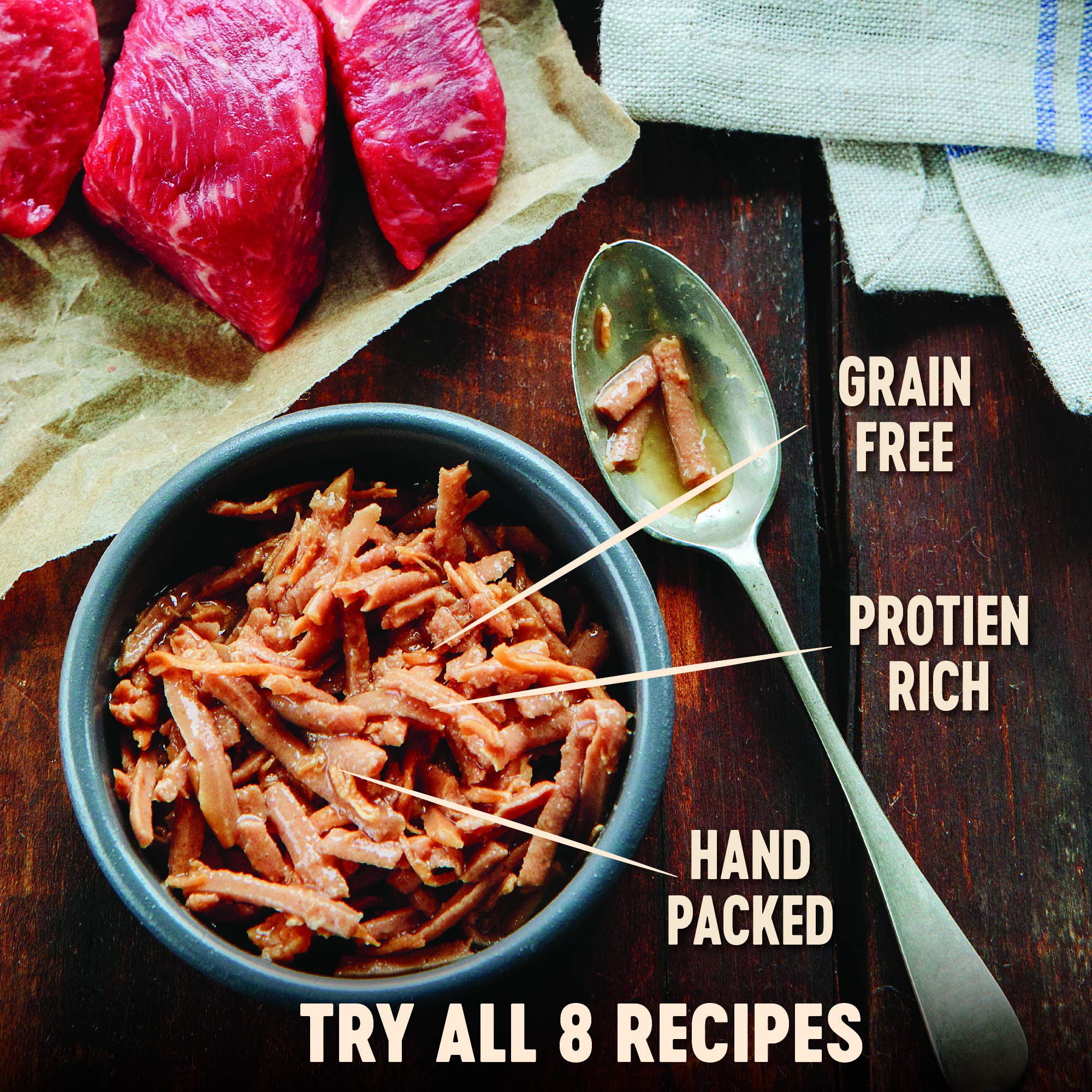 Wellness CORE Signature Selects canned cat food with real meat shreds in sauce.