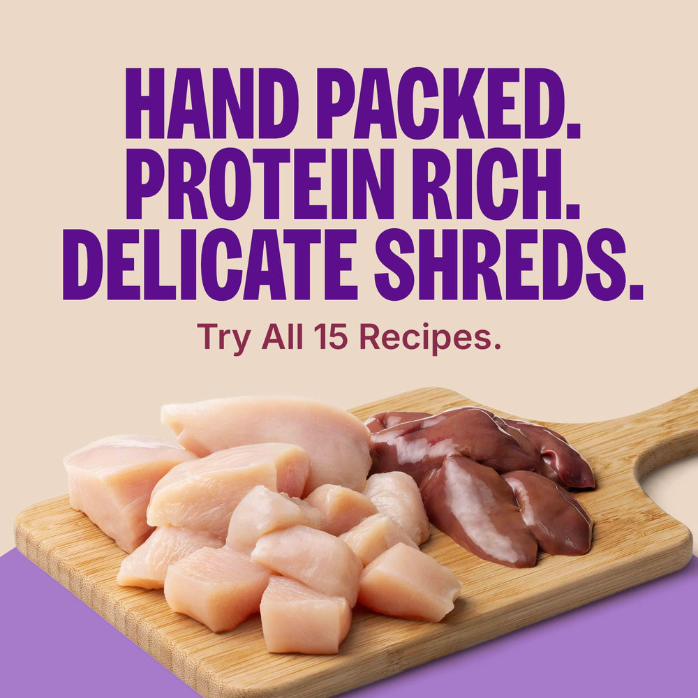 Open can of Wellness Core Signature Selects showing shredded chicken and turkey in sauce