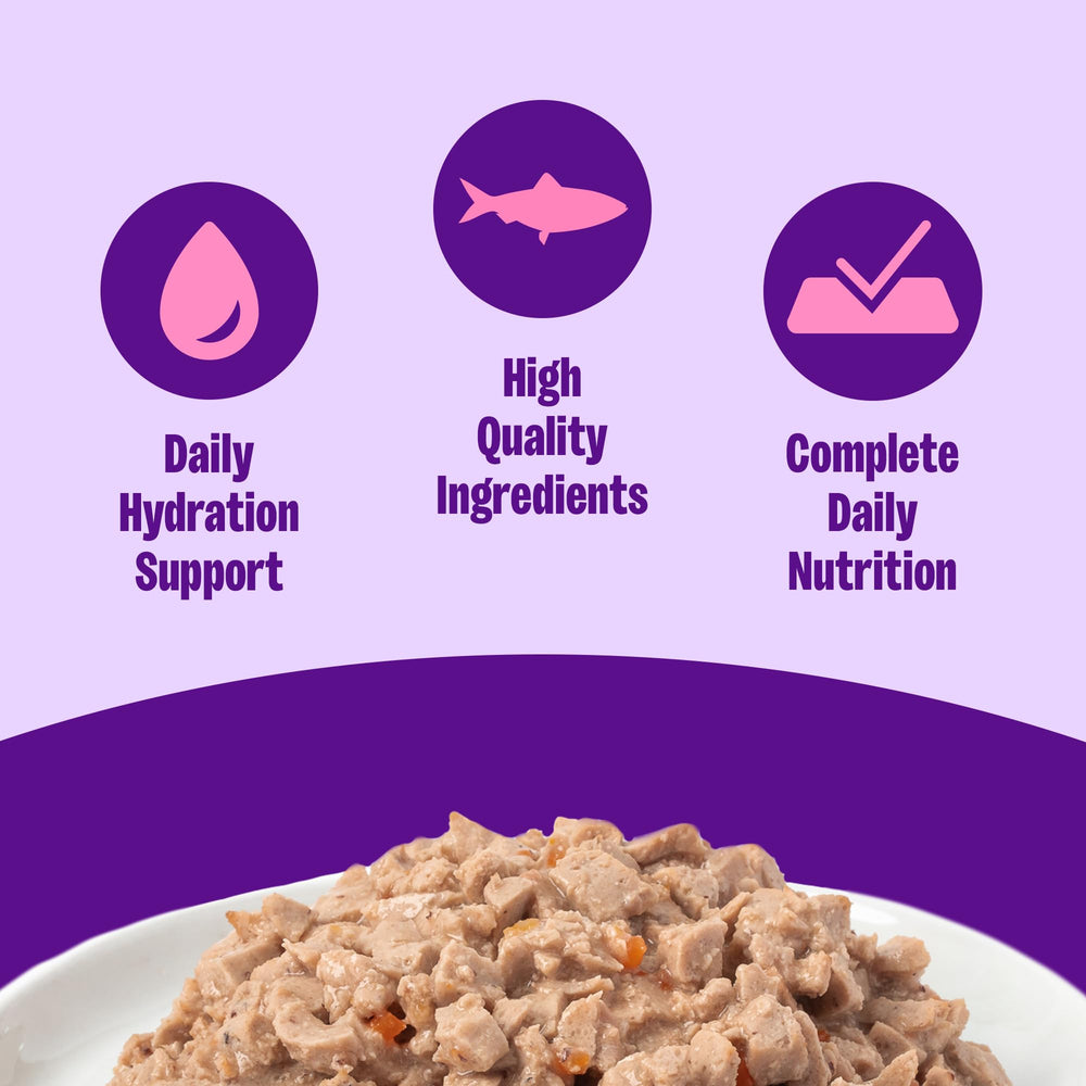 Wellness Minced Tuna Dinner close-up shows tiny tuna pieces in light gravy for easy chewing.