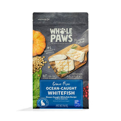 Whole Paws Ocean-Caught Whitefish Recipe kibble spilling from bag, premium grain-free nutrition.