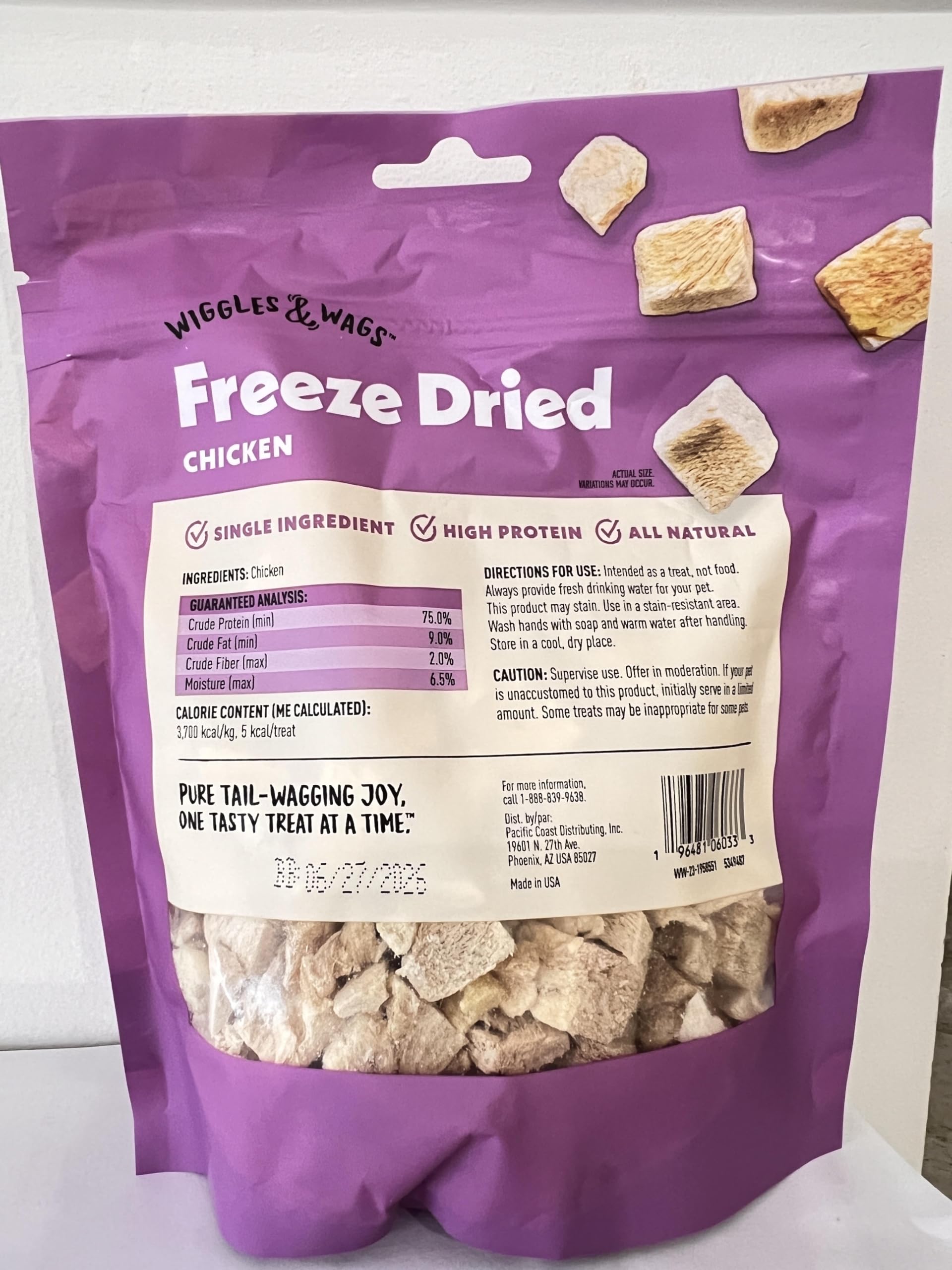 Close-up shows the crunchy texture of Wiggles & Wags freeze-dried chicken treats