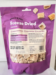 Close-up shows the crunchy texture of Wiggles & Wags freeze-dried chicken treats